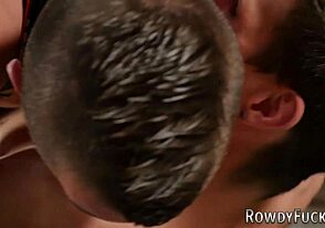 Muscular men in steamy wrestling