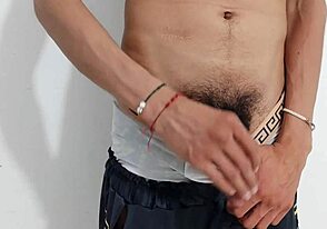 Gay guy strokes uncut cock